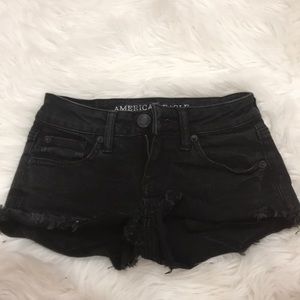 Black ripped shorts
